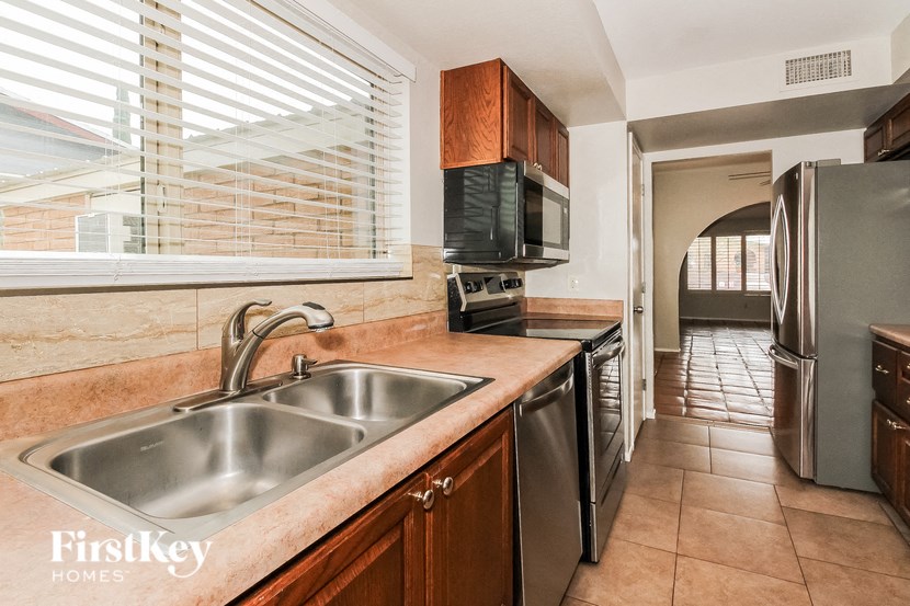 a kitchen with stainless steel appliances and a sink