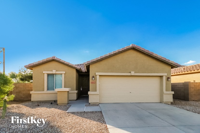 a home with a driveway and a garage door