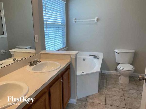 a bathroom with a sink and a toilet and a tub