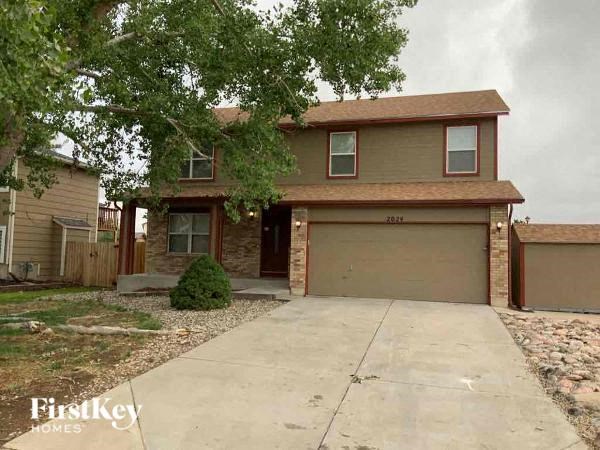 a house with a driveway and a garage door