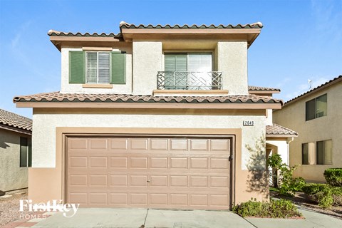 a house with a garage door in front of it