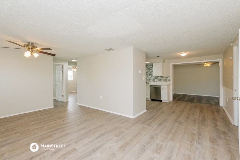 the living room and kitchen of an apartment