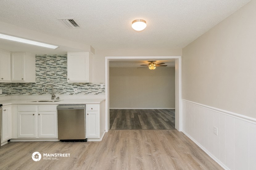 the kitchen and living room of our two bedroom apartment atrium