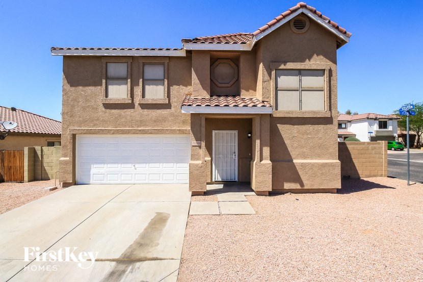a house with a white garage door in front of it
