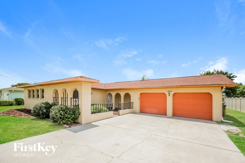 a house with a driveway and a garage door
