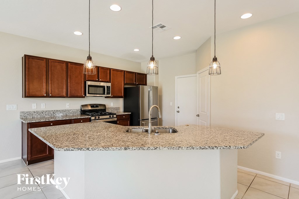 a kitchen with granite counter tops and a sink