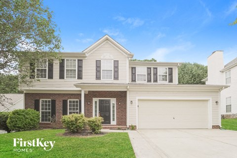 A house with a garage is for sale by FirstKey Homes.