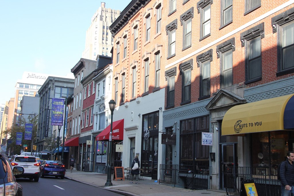 a city street with buildings and cars on it