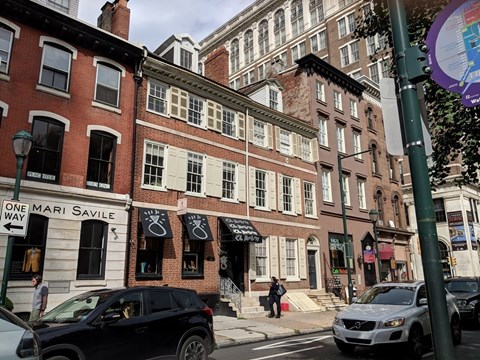 a street view of a brick building on a city street