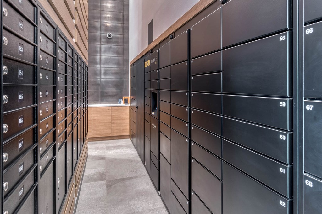 A long hallway with black filing cabinets on both sides.