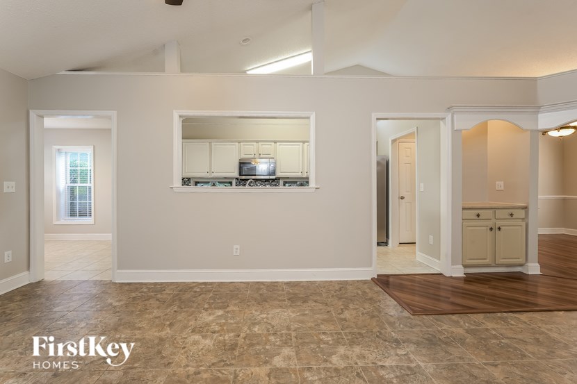 A kitchen area with a countertop and cabinets.