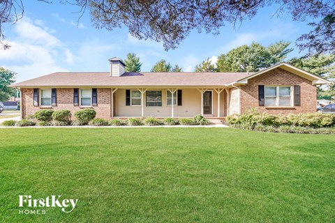 a house with a lawn in front of it