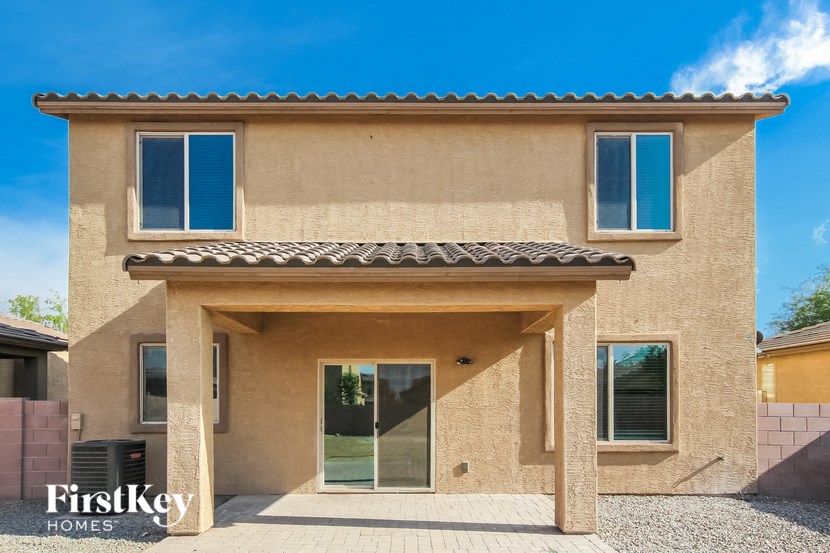 a brown house with blue windows and a door