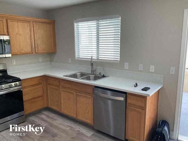 a small kitchen with a sink and a stove