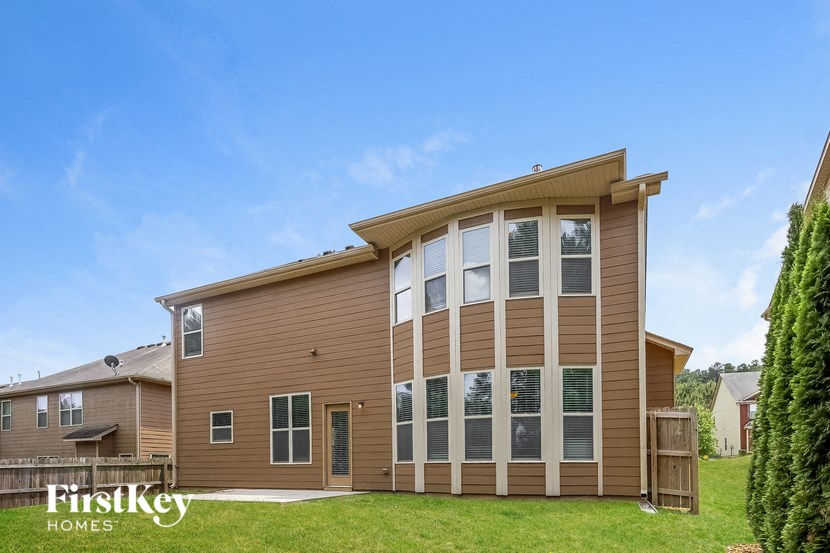 the view of a house with large windows on the side