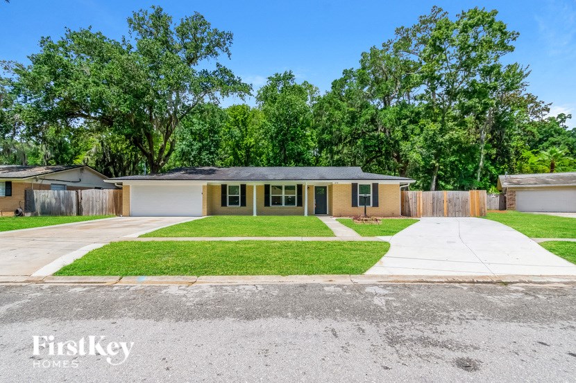a home with a lawn and a driveway