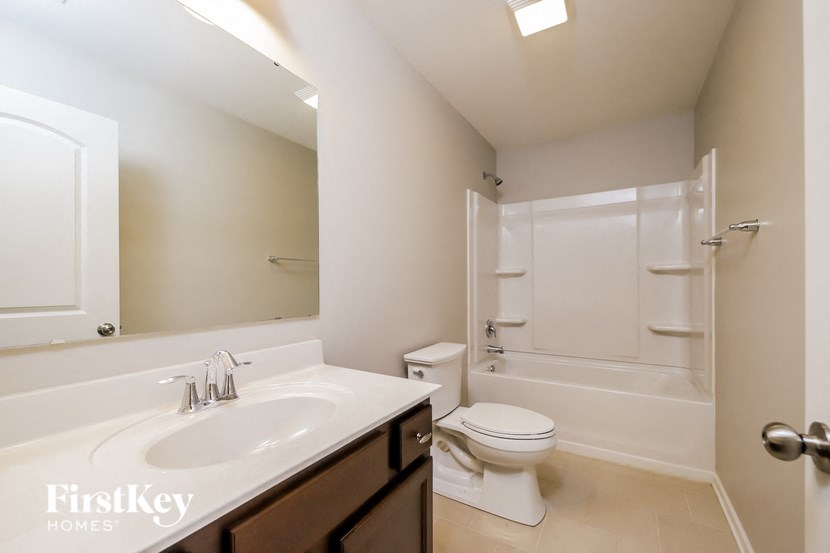 a bathroom with a sink toilet and a shower