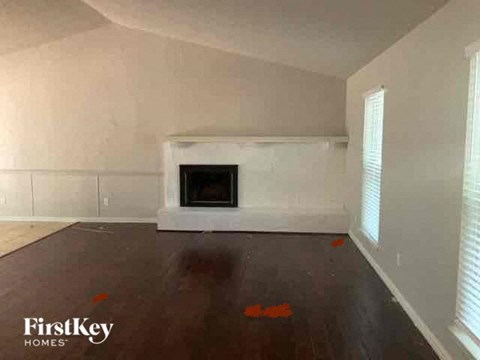 a view of a living room with a fireplace