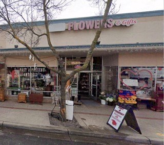 A flower shop named Flowers & Gifts is visible in the image.