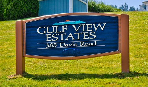 a sign for gulf view estates on the grass