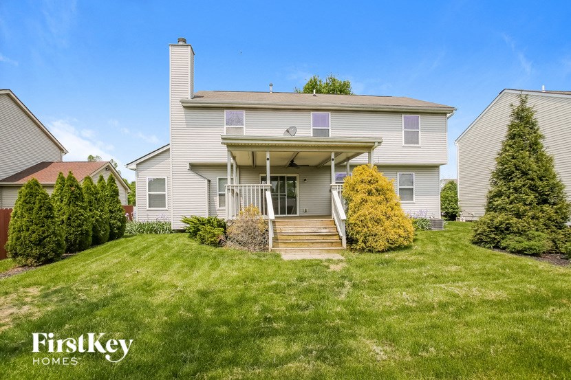 a white house with a lawn in front of it