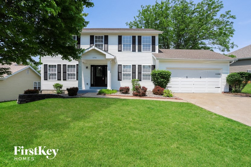 A white house with a black door and windows is shown with the words "FirstKey Homes" on the bottom.