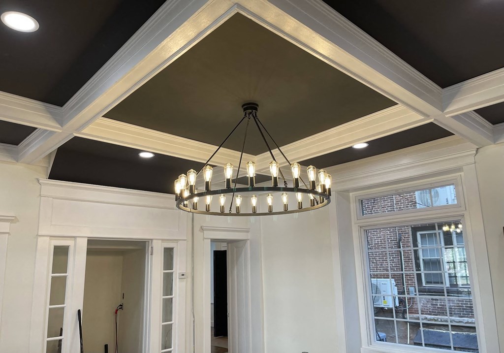 a view of the chandelier from the entryway of a home