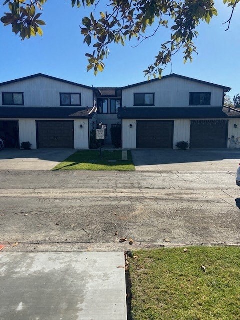 A two-story house with a garage on the side.