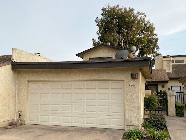 A house with a white garage door and the number 948 on it.