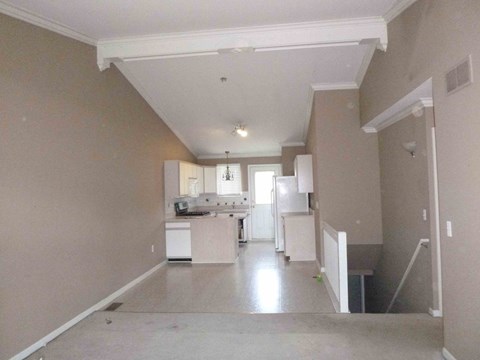A kitchen with white appliances and a white refrigerator.