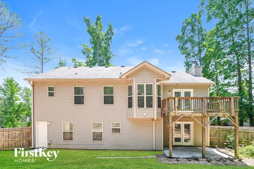 a house with a deck on the back of it