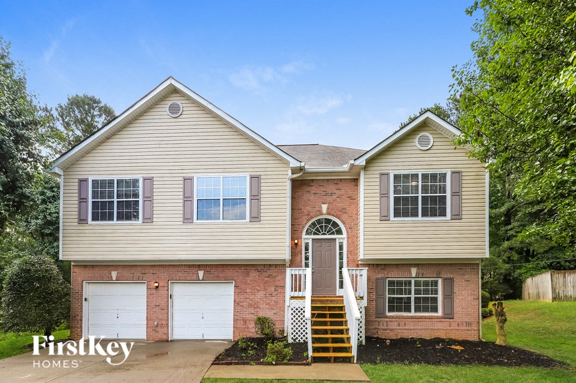 a house with two white garage doors