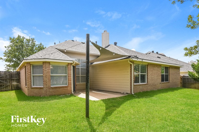 the exterior of a house with a yard and grass