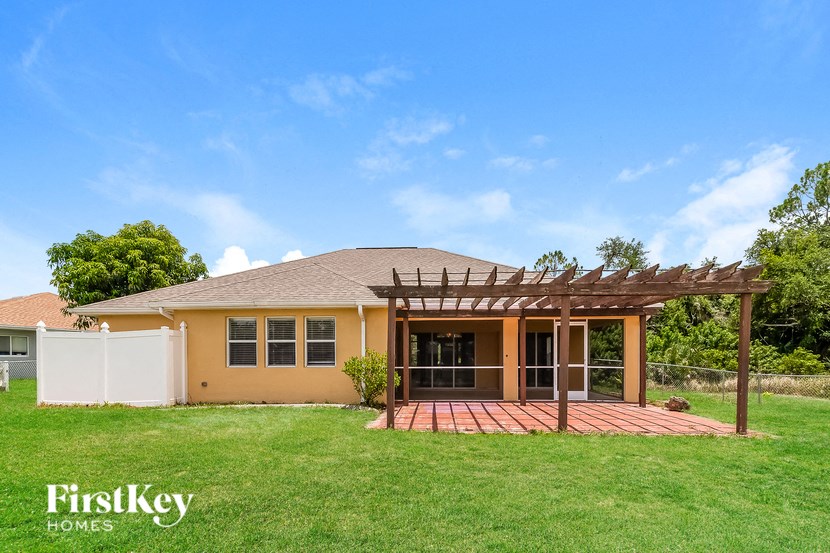 a house with a covered porch and a grassy yard