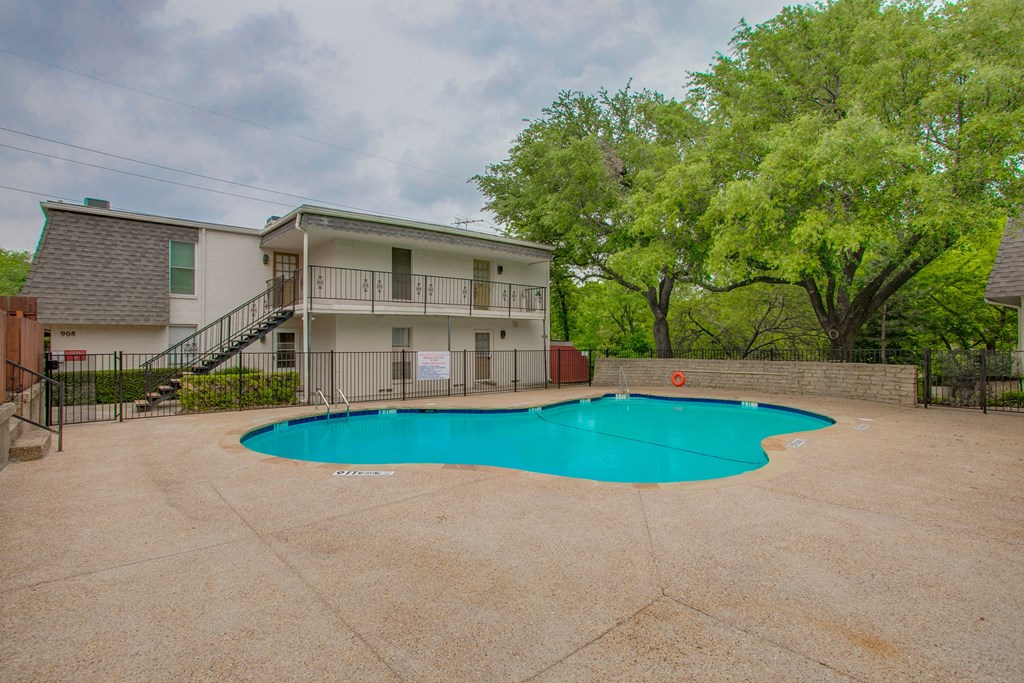 our apartments have a large pool and a building with a staircase