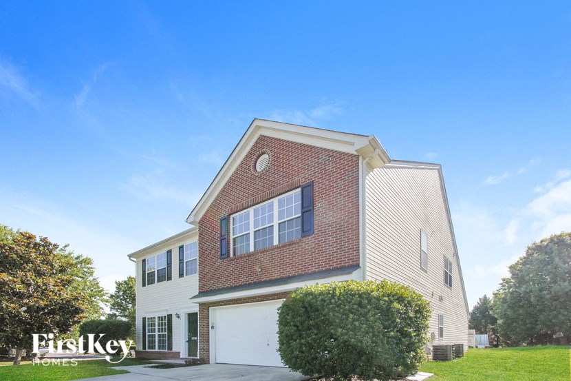 a side view of a house with a garage door