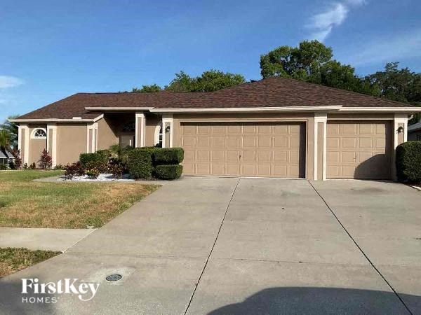 a house with a driveway and a garage door