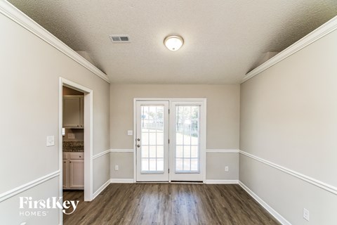 A room with a door and a window.