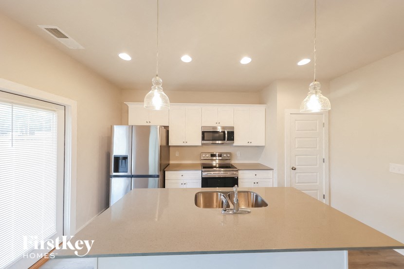 A kitchen with a large island in the middle.