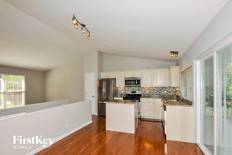 A kitchen with a counter top and cabinets.