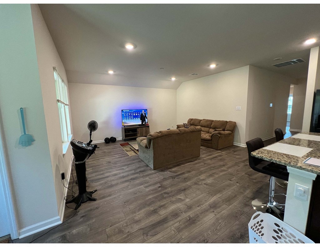 a living room with a couch and a tv