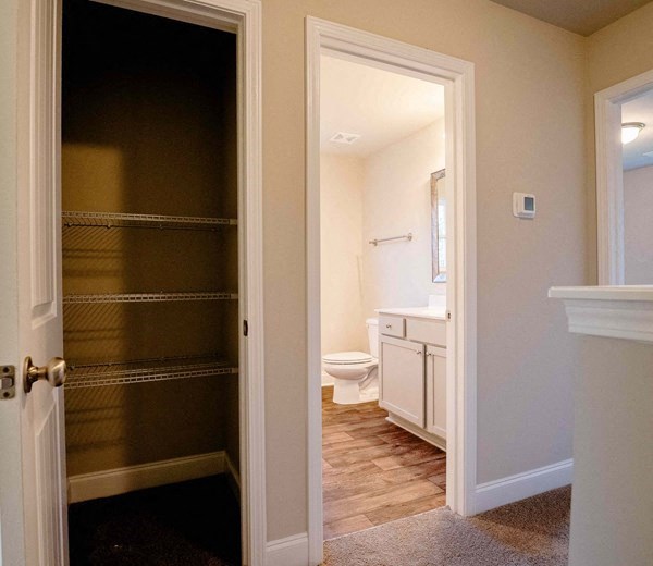 a bathroom with a toilet and a sliding glass door
