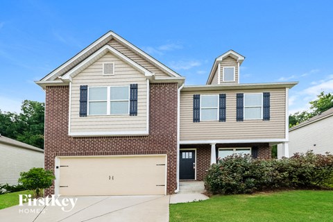a brick house with a white garage door