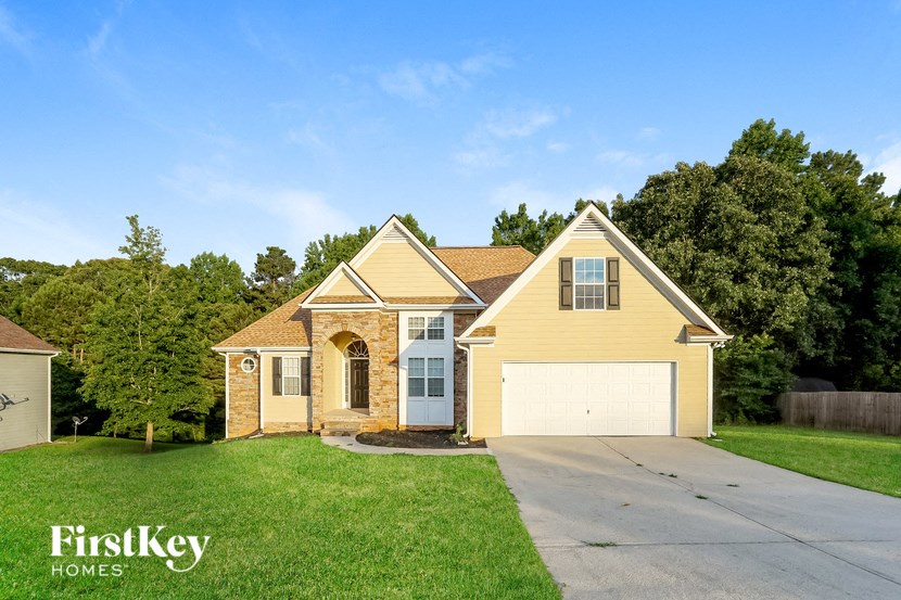 A house with a garage is for sale by FirstKey Homes.