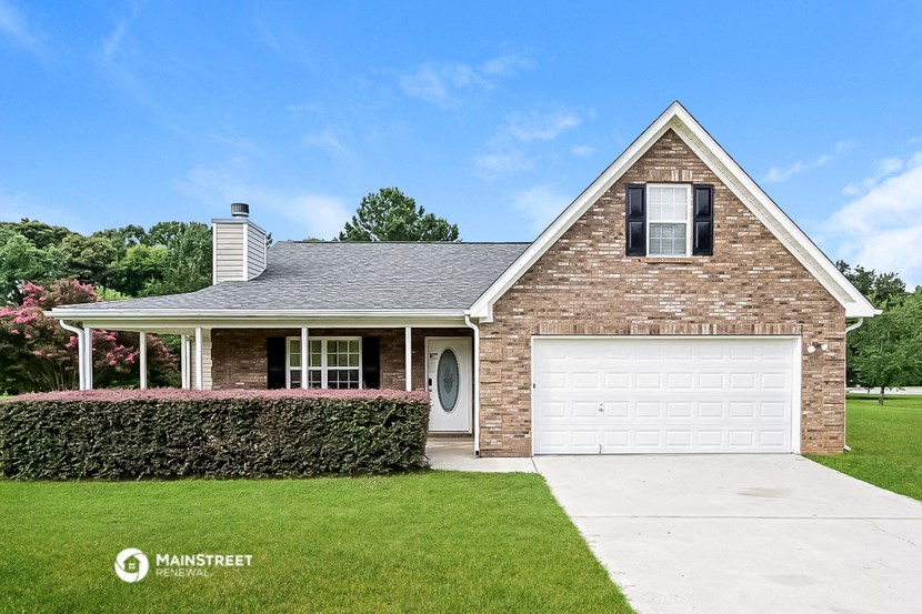 a brick house with a white garage door