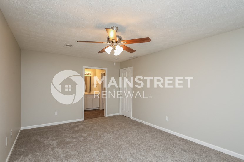 a living room with a ceiling fan