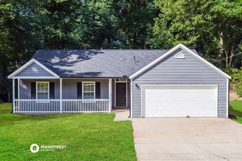 a blue house with a white garage door