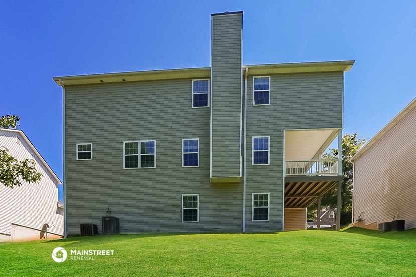 a large house with green grass in front of it