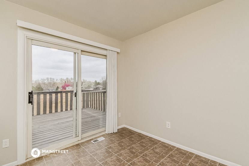 the living room of a house with a patio door