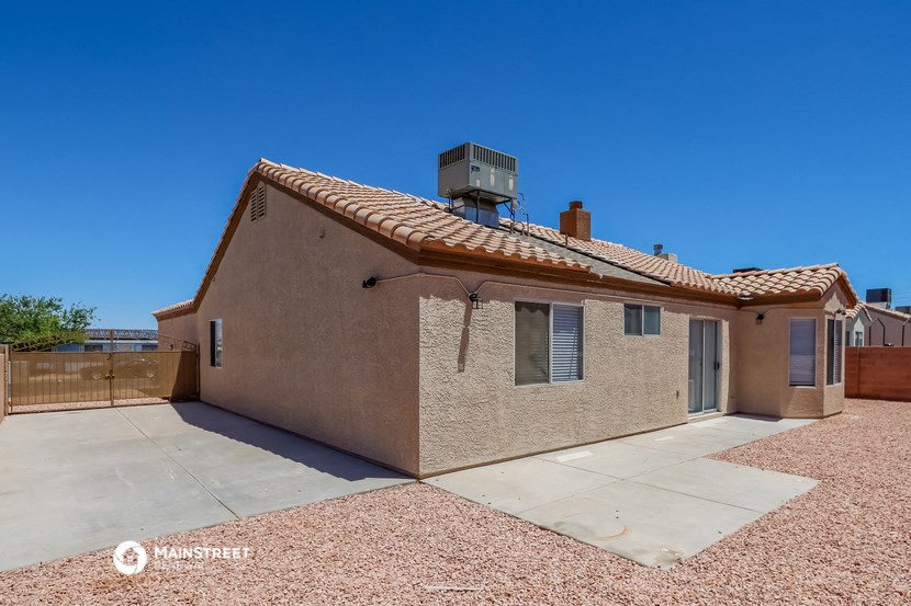 a small brick house with a satellite dish on the roof